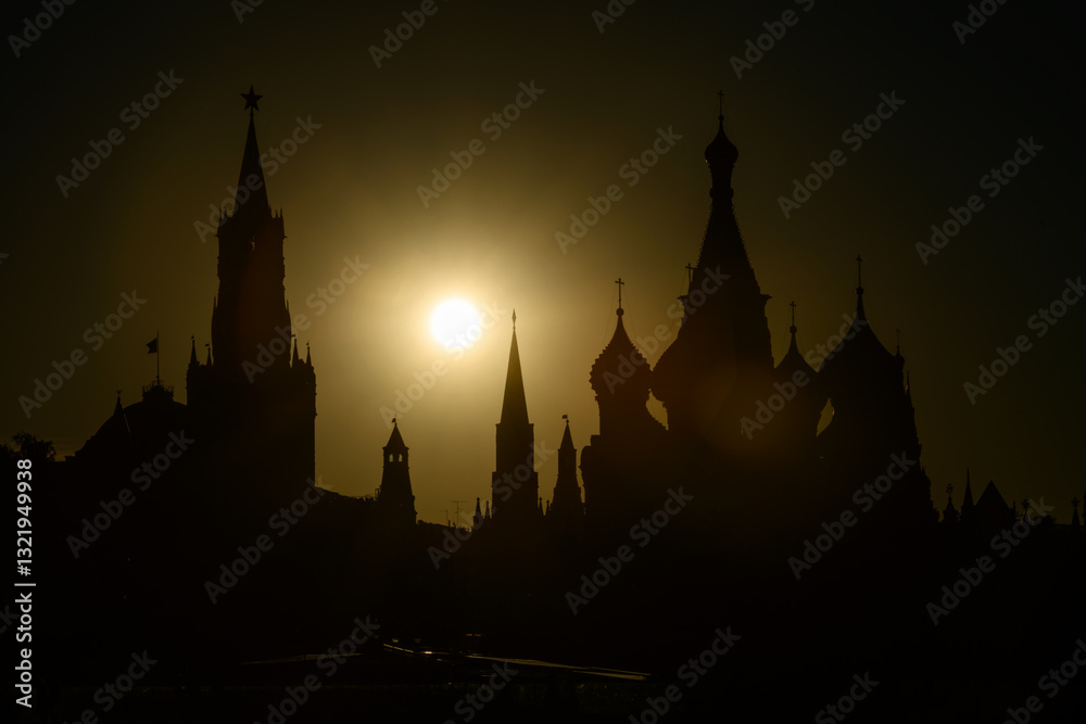 Silhouette of Moscow at sunset, Russia. Kremlin and St Basil's Cathedral against sun in evening, landmarks of city center in sunlight, concept of skyline and travel