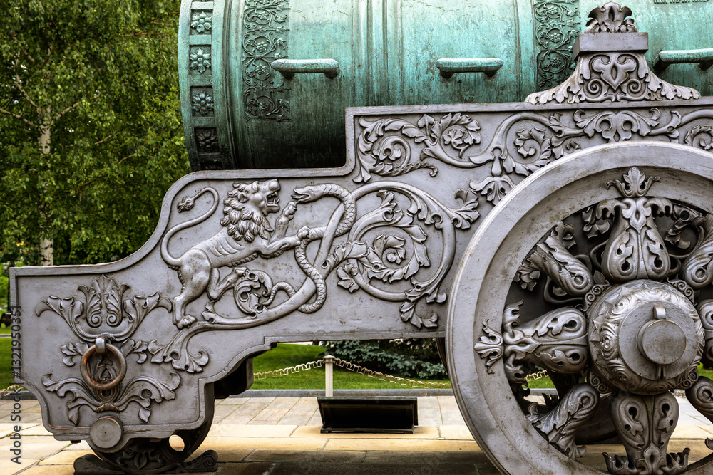 Detail of luxury Tsar Cannon (King of Cannons) in Moscow Kremlin, Russia. Ornate gun carriage and wheels, old vintage landmark