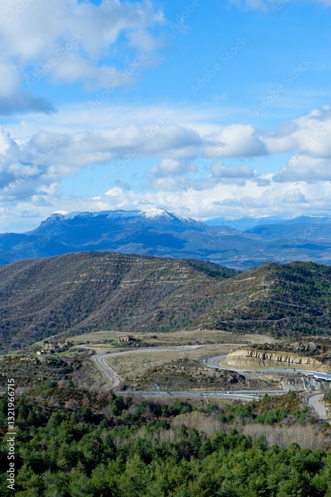 Fototapeta premium Aerial view from summit on Pyrenees mountain range. Early spring, vivid cloudscape