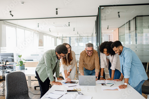 Professional team in a business environment, analyzing financial reports and discussing innovative strategies. A collaborative office setting where employees share ideas and work on corporate success.