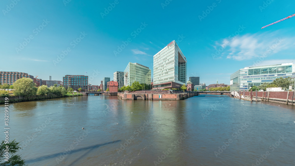Obraz premium Panorama showing Hamburg HafenCity skyline timelapse at Ericusgraben with a view of modern Spiegel office buildings