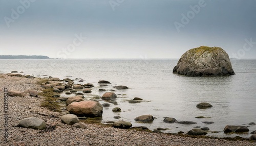 Gentle cliffs and a calm shoreline stretch beneath a hazy horizon, evoking a sense of tranquil coastal beauty.