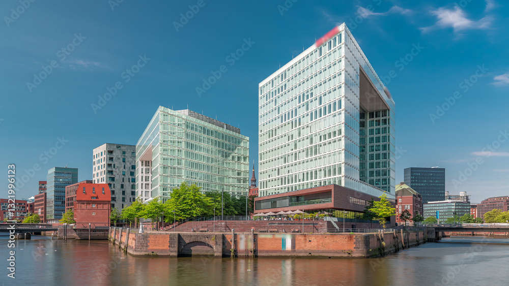 Obraz premium Timelapse of Hamburg HafenCity skyline at Ericusgraben with a view of modern Spiegel office buildings