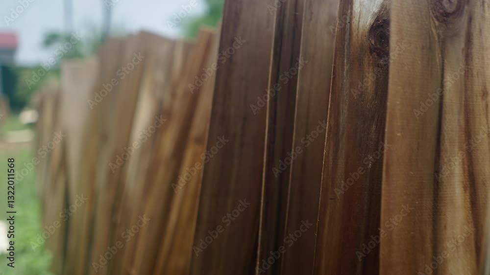 wooden boards of various thicknesses arranged in an outdoor warehouse in vietnam
