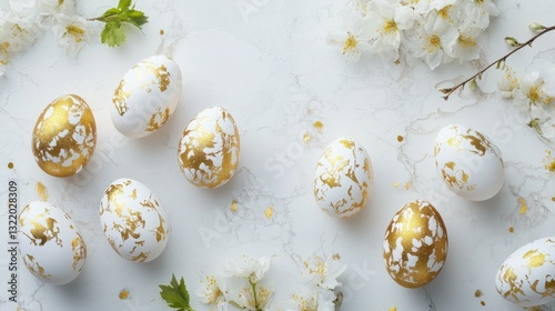 Beautiful easter background with painted golden decoration on easter eggs on white table. Top view and flat lay style.