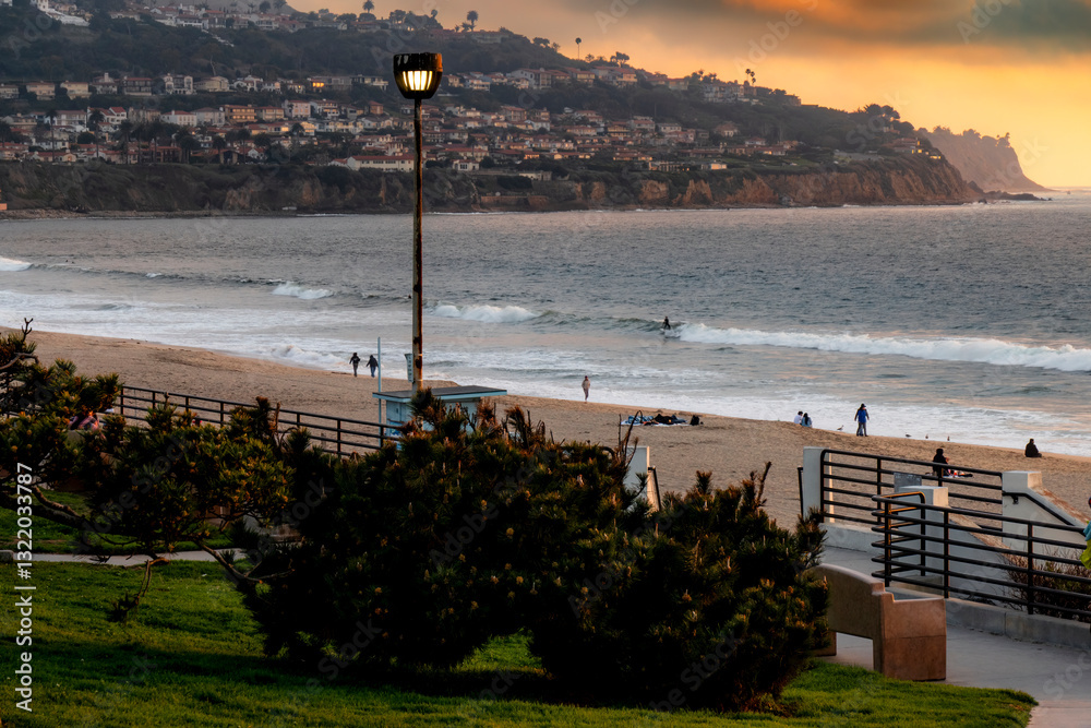 A beautiful day along the coastline of Southern California with Redondo Beach in the foreground and Palos Verdes in the background, separated by beach landscape and ocean background