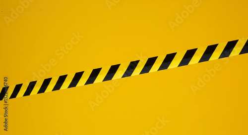 Wallpaper Mural A Stark Warning, A Black And Yellow Caution Tape Diagonally Cutting Across A Vibrant Yellow Background, Conveying Urgency And Safety Precautions Torontodigital.ca