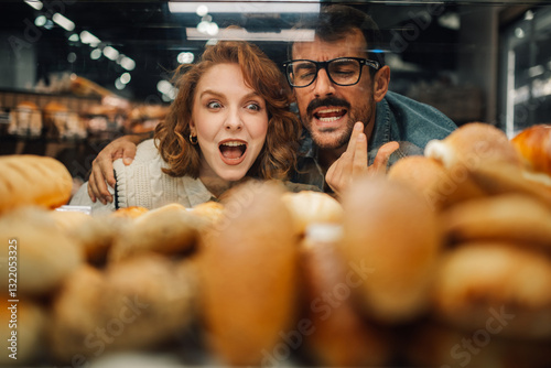 Wallpaper Mural Excited couple choosing bread from bakery display, Torontodigital.ca