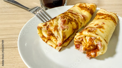 Canvas-taulu Rolled pancakes with meat filling on plate, perfect for breakfast, brunch, or Sh