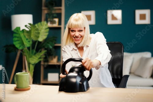 Enthusiastic woman playing racing game with steering wheel at desk photo
