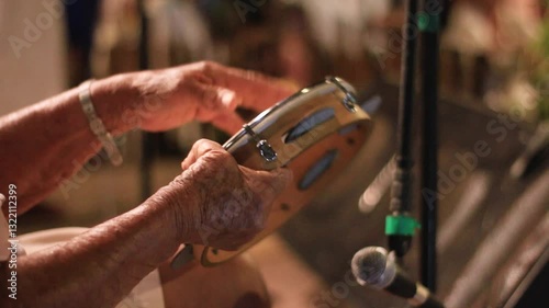 musician playing tambourine, percussion instrument