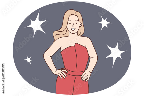 Celebrity woman poses for reporters standing in evening dress during film festival or award ceremony