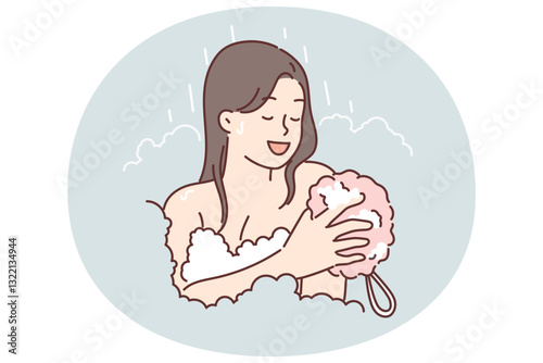Woman takes shower using washcloth and stands among foam enjoying hygiene procedures