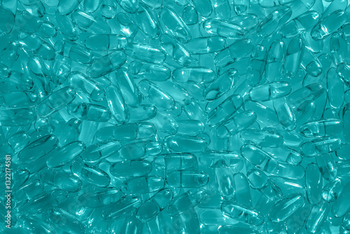 Aqua blue artificial capsules omega 3 background simple backdrop for presentation, screensaver, wallpaper. Design for postcard, poster, banner, cover, website, publication. High quality photo