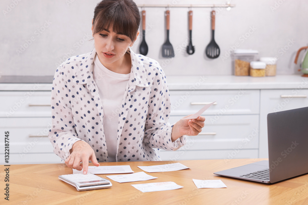 Paying bills. Woman with different invoices and calculator at wooden table indoors Paying bills. Woman with different invoices and calculator at wooden table indoors