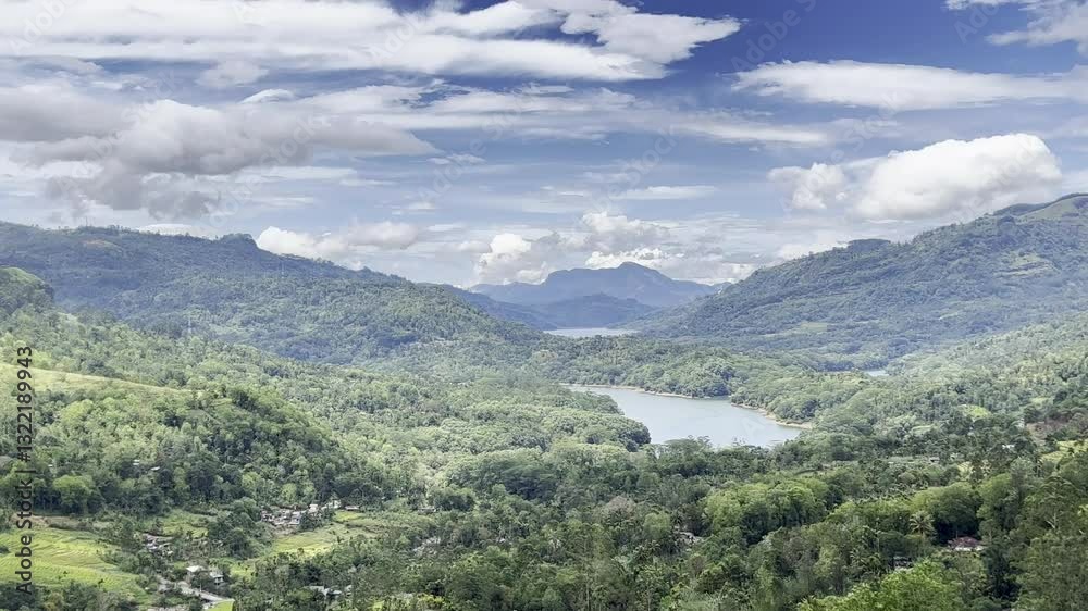 view of jungle valley with lake in tropical city in mountains on sunny rainy day travel atmosphere