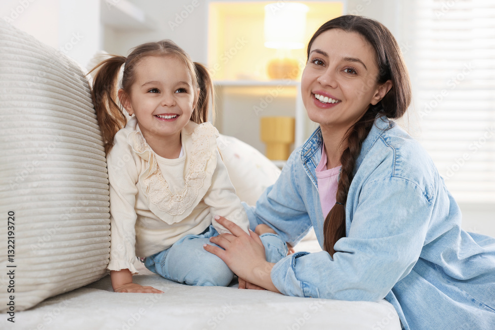 Happy mother with her cute daughter spending time together at home Happy mother with her cute daughter spending time together at home