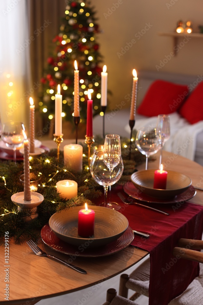 Festive table setting in room decorated for Christmas. Bokeh effect Festive table setting in room decorated for Christmas. Bokeh effect