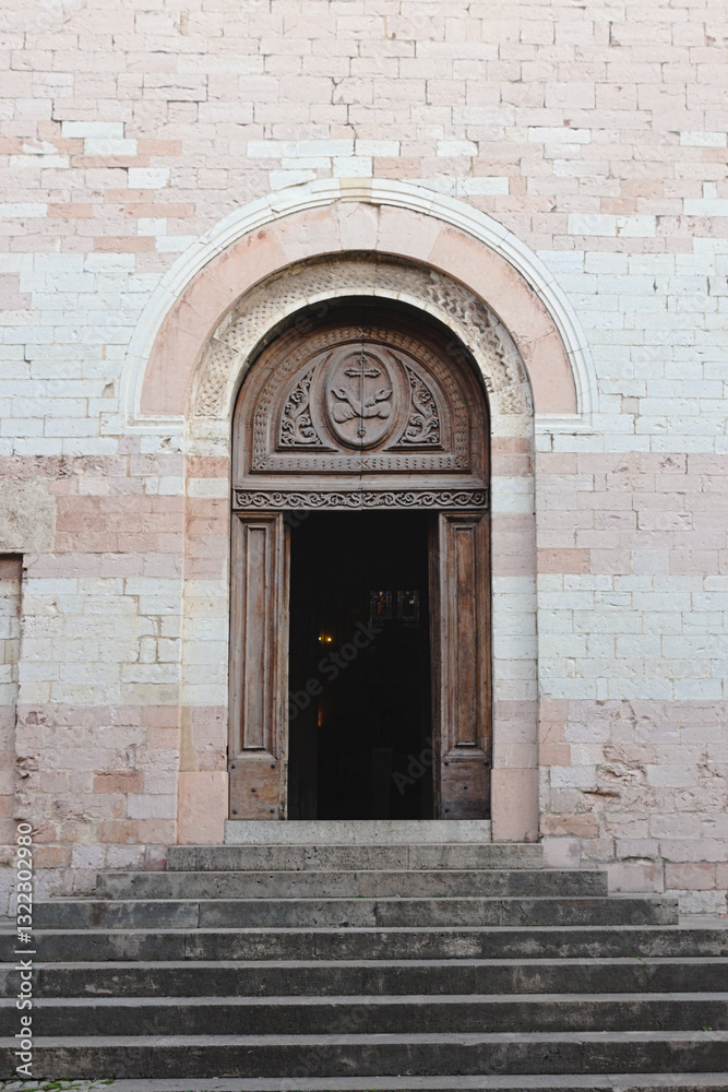 Fototapeta premium The entrance of the ancient Church Sant'Andrea in Spello, Umbria Region, Italy