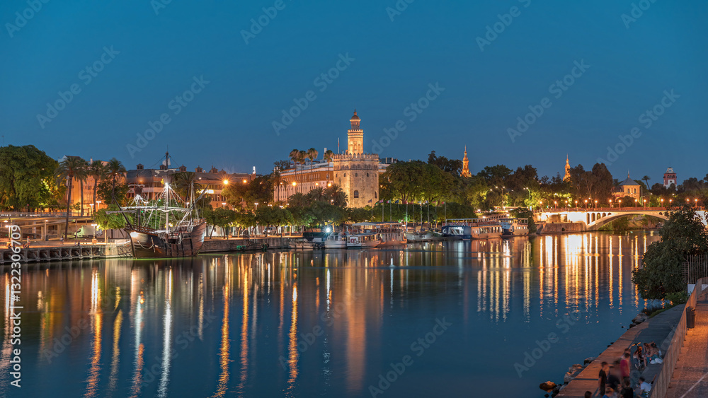 Torre del Oro day to night timelapse on Guadalquivir River in Seville, Spain Torre del Oro day to night timelapse on Guadalquivir River in Seville, Spain