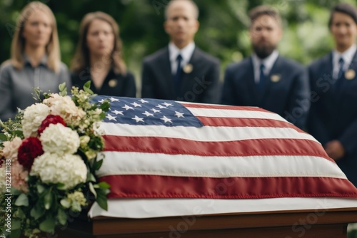 Grieving family attending military funeral with american flag on casket
