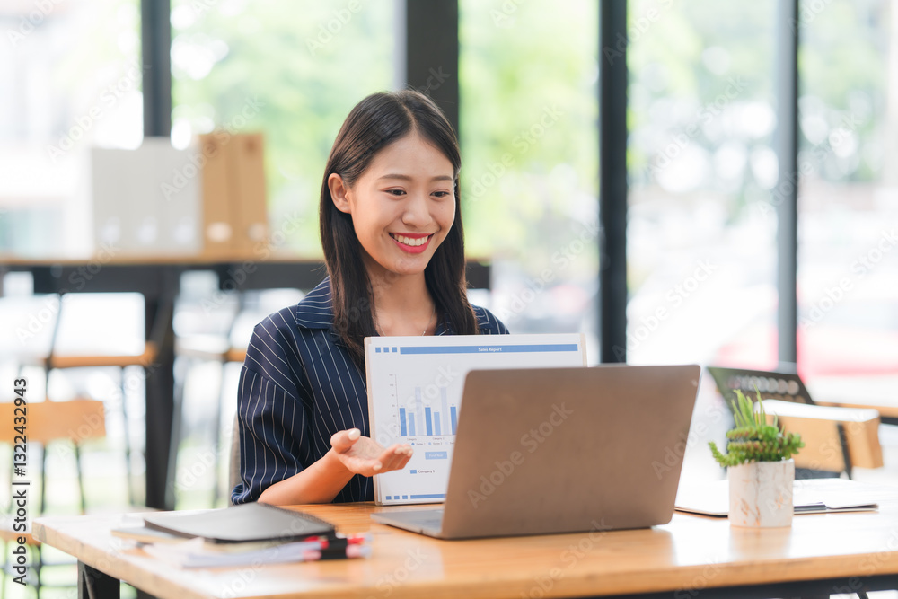 Smiling Asian Businesswoman Presenting Data Online Smiling Asian Businesswoman Presenting Data Online