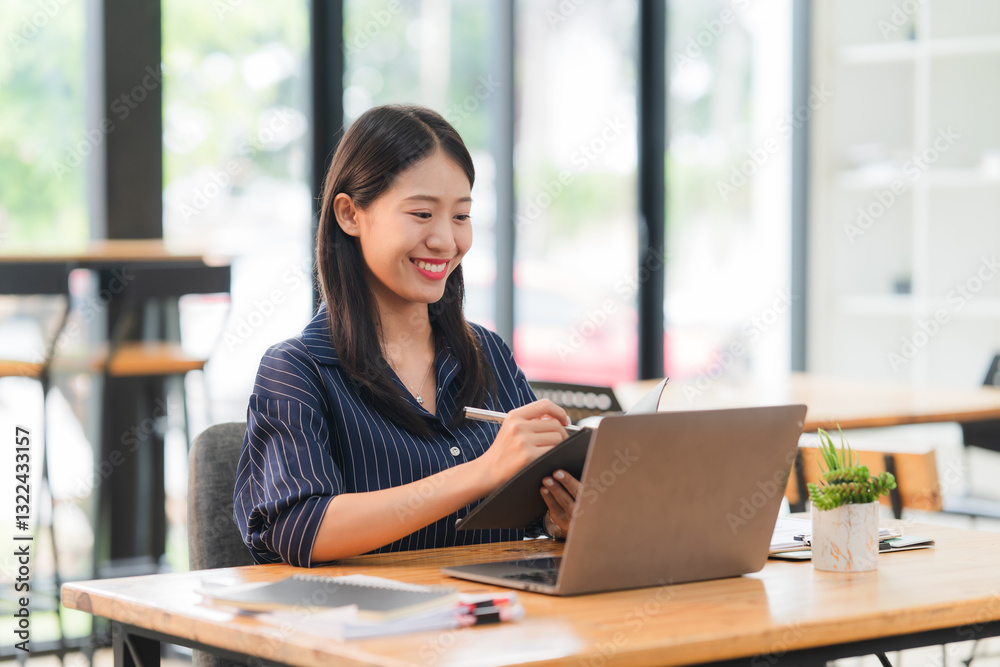 Smiling Asian Woman Working at Desk Smiling Asian Woman Working at Desk