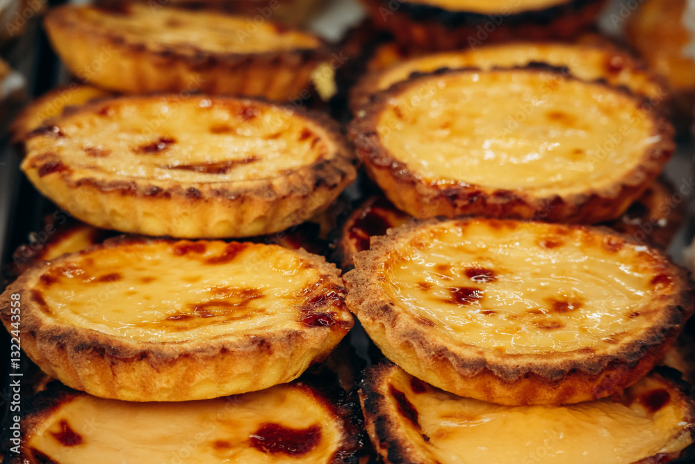 Fresh and appetizing Tarte de Nata in central Lisbon, a classic Portuguese pastry Fresh and appetizing Tarte de Nata in central Lisbon, a classic Portuguese pastry