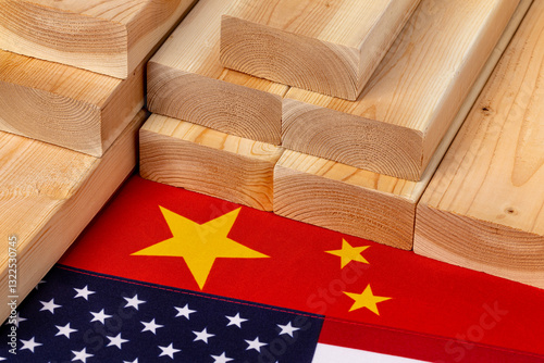 Construction lumber with United States and China flags . Trade tariffs, import ban and trade war concept. 