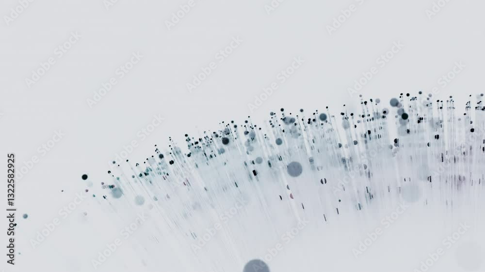Delicate strands of a fiber optic lamp burst into an array of turquoise dots, creating a serene, otherworldly glow against a pure white background.