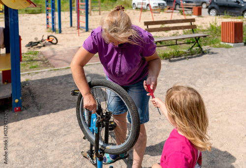 babysitter and child on on a bike ride