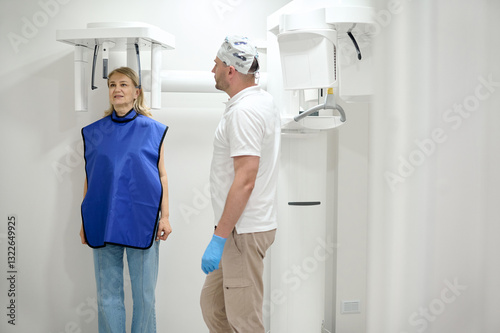 woman doing teeth roentgen at light medical clinic