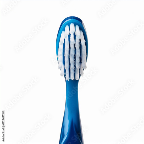 Close-up of a blue toothbrush with white and blue bristles for dental hygiene and oral care