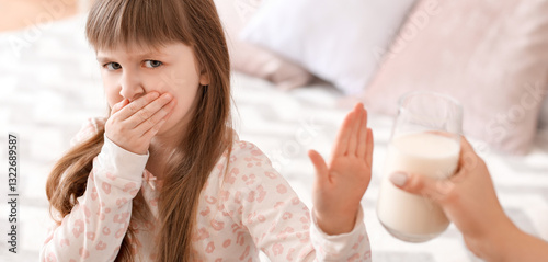 Little girl with milk aller...