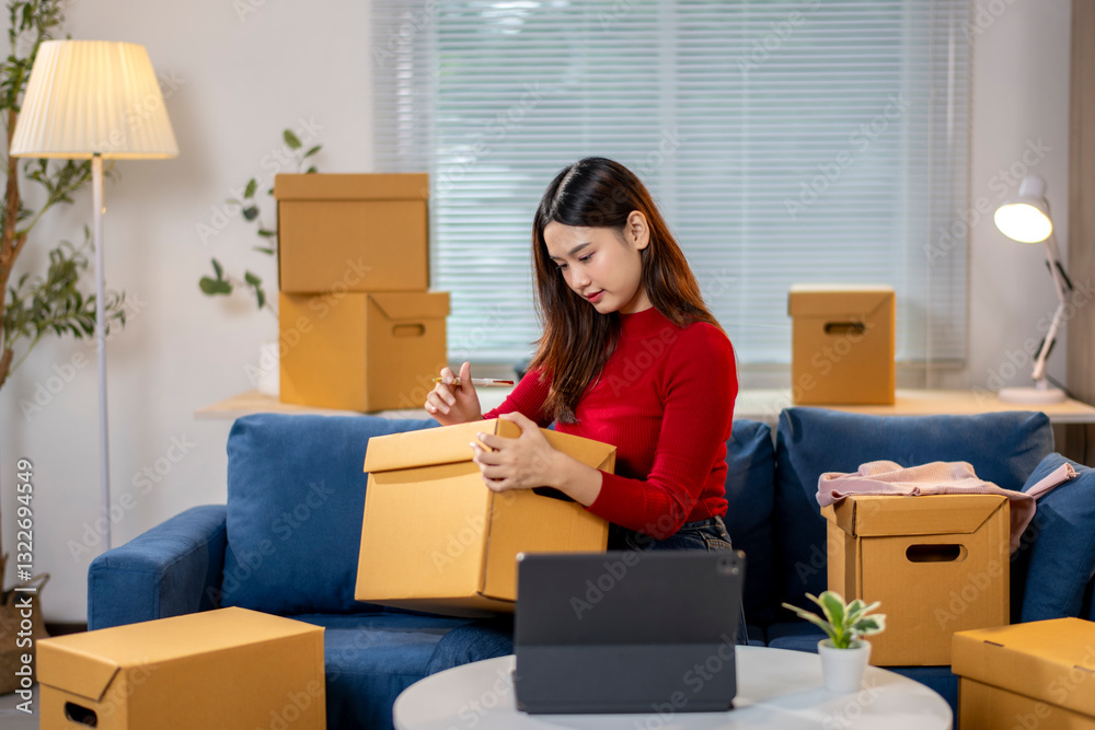 A woman sits on a couch surrounded by cardboard boxes A woman sits on a couch surrounded by cardboard boxes