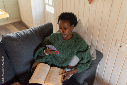  Woman using phone at home photo