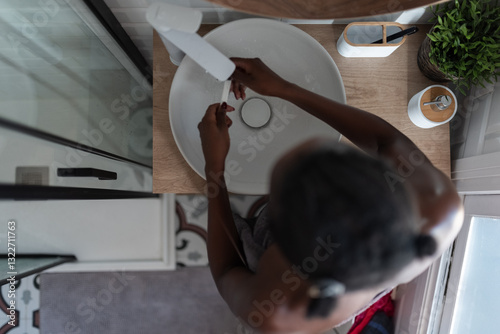 Woman cleaning toothbrush 