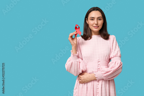 Pretty young woman holding ...