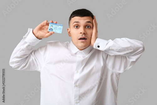 Young surprised man with dr...