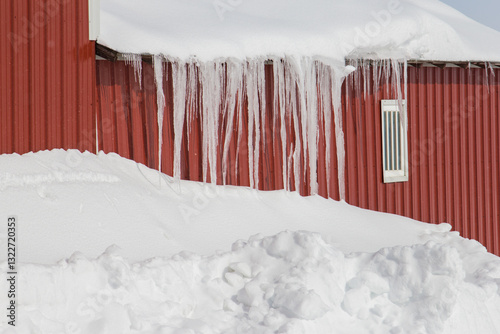 icicles hanging off a barn roof