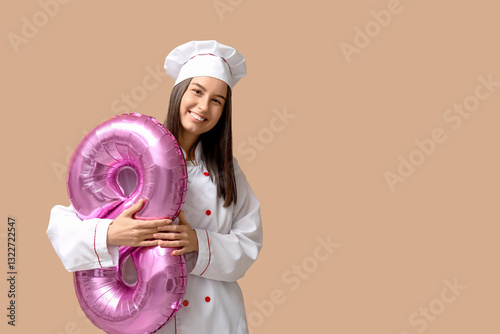 Female chef with balloon in...