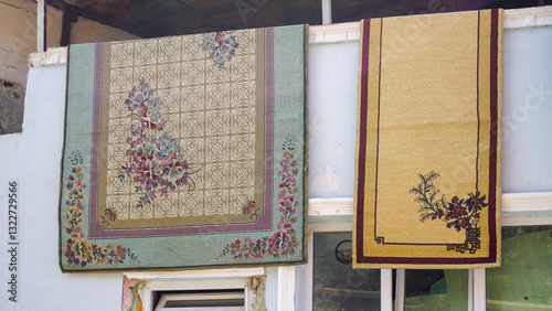old vintage carpets hanging to dry