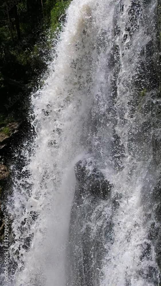 Vertical video of Kamyshlinsky Waterfall. Waterfall located at the mouth of the river Kamyshla in Shebalinsky District of the Republic Gorny Altai. Vertical video of Kamyshlinsky Waterfall. Waterfall located at the mouth of the river Kamyshla in Shebalinsky District of the Republic Gorny Altai.
