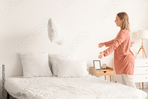 Pretty young woman throwing...