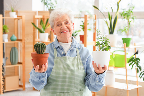 Senior florist with plants ...