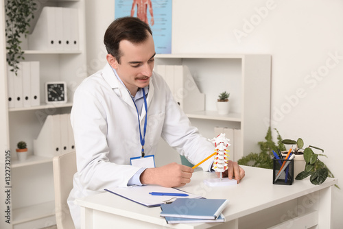 Male doctor demonstrating s...
