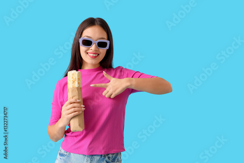 Young Asian woman pointing ...