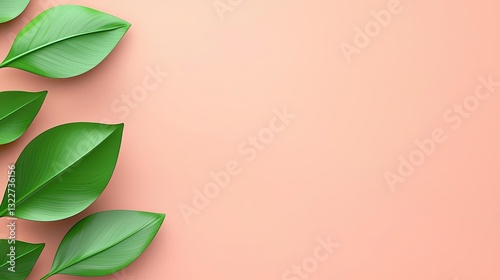 Abstract landscape background concept. Fresh green leaves on a soft peach background for a calming nature aesthetic.