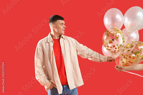 Young man taking bunch of b...