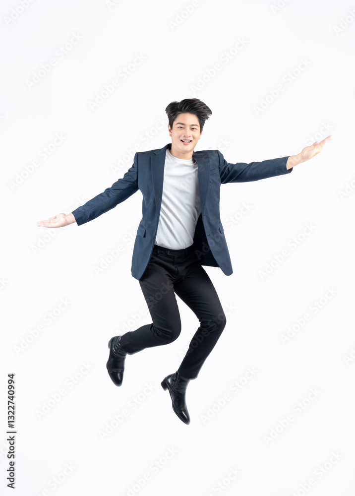 Full body image of a young Asian business man jumping on a white background Full body image of a young Asian business man jumping on a white background